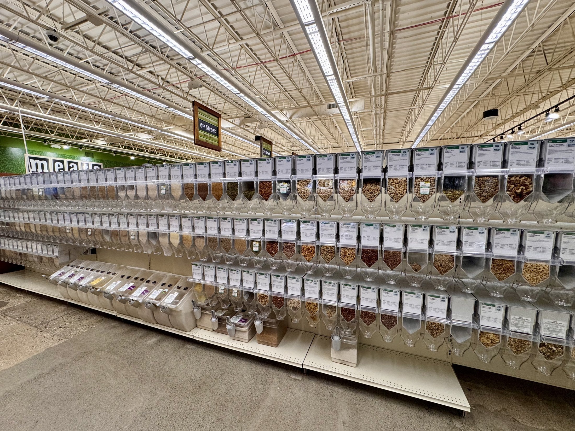 A wide view of the Outpost Co-op bulk aisle with Purcell dispensers