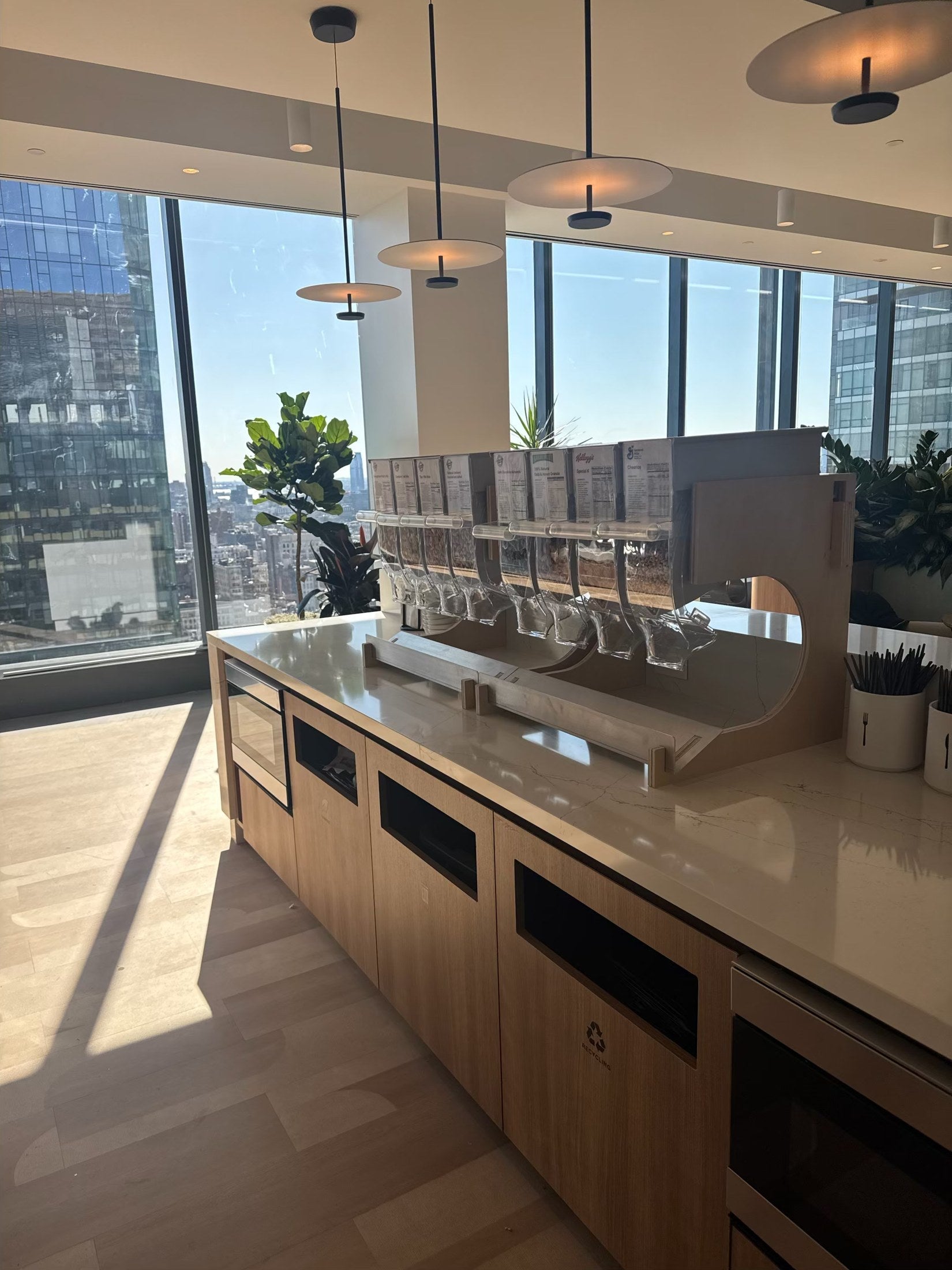 Purcell dispensers on a countertop beside large office windows