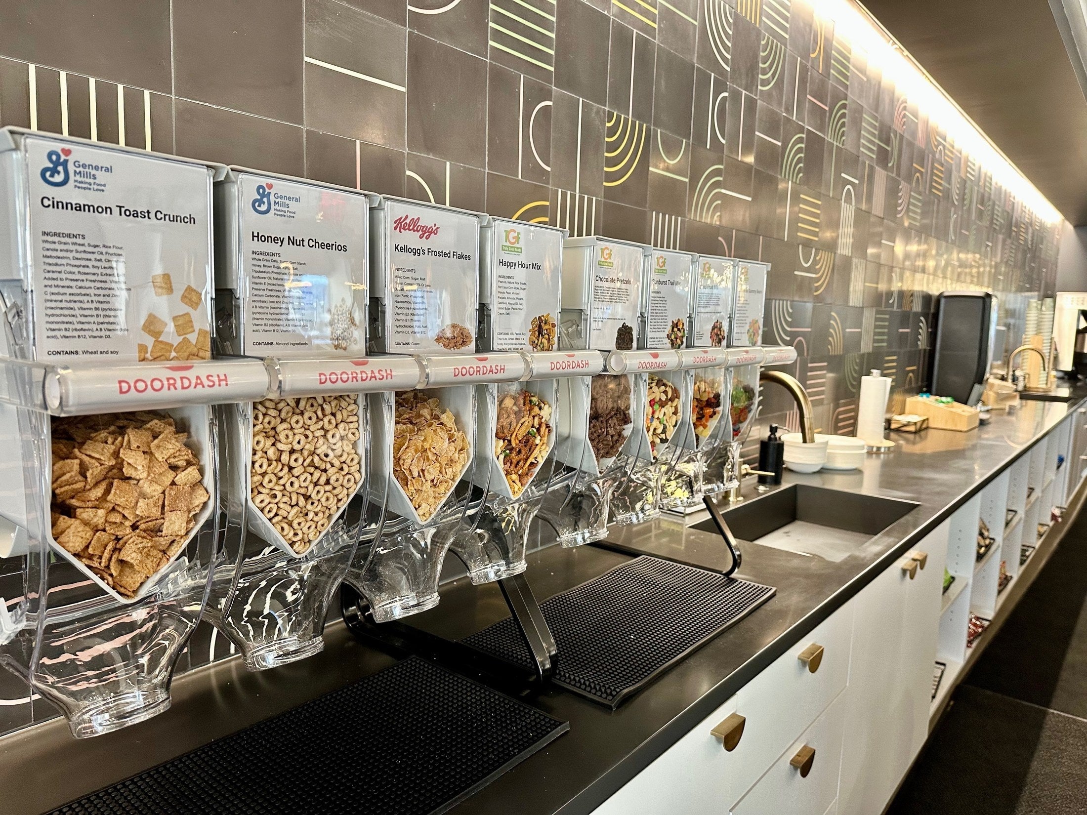 DoorDash-branded Purcell dispensers filled with cereals and snacks
